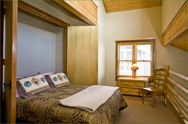 There is another large bed in the loft overlooking the living areas.